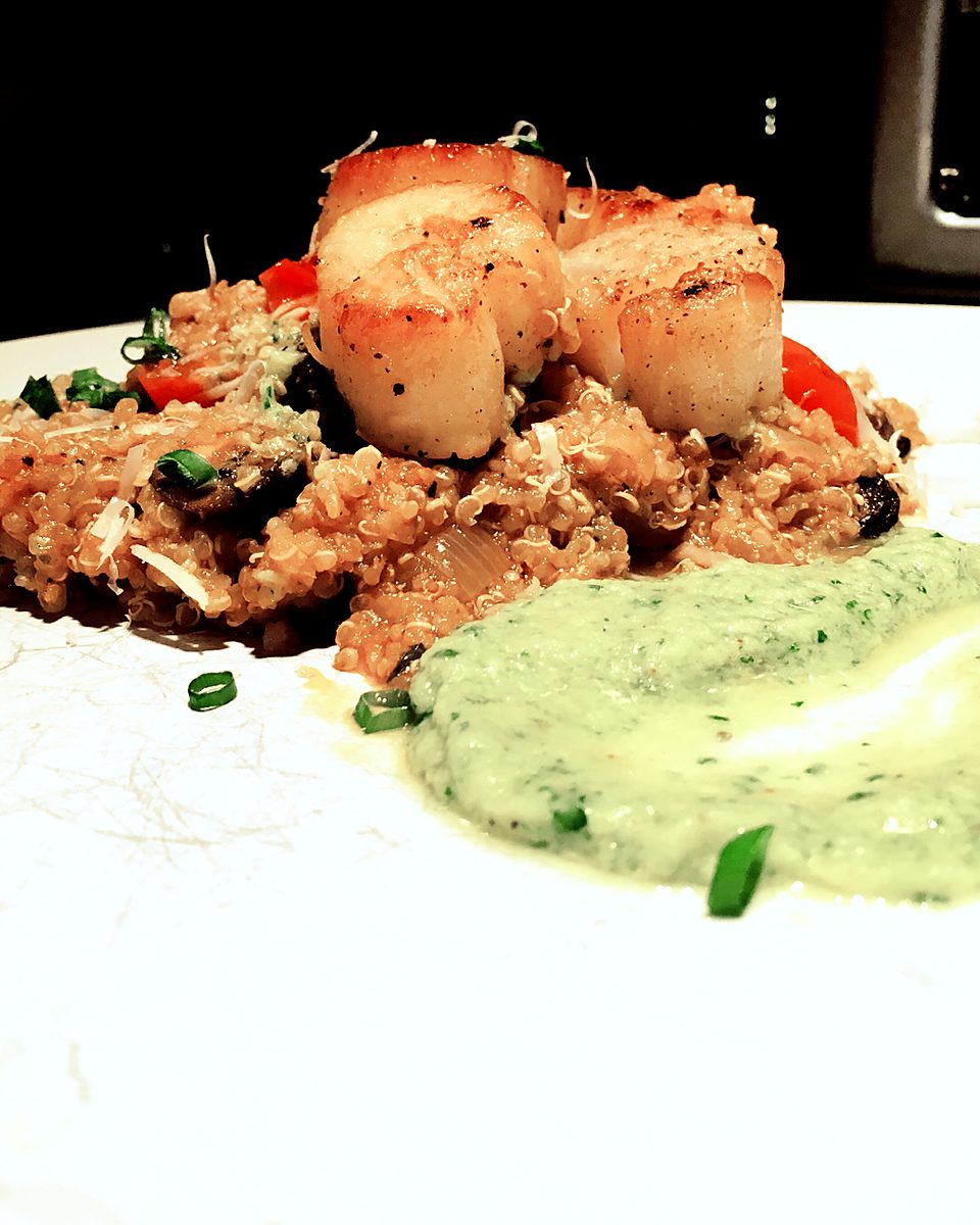 Seared scallops on quinoa with an herb purée